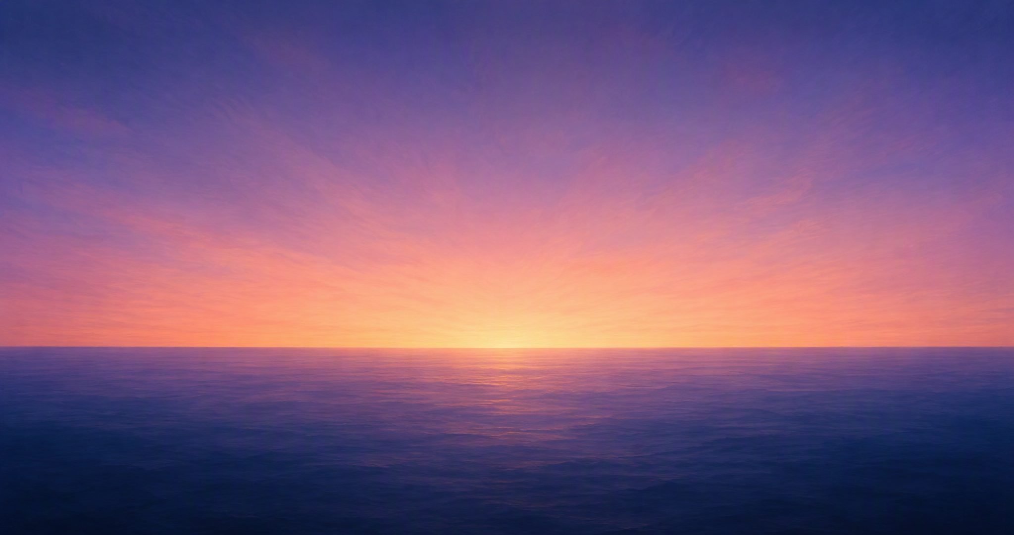 First light over an endless calm ocean horizon